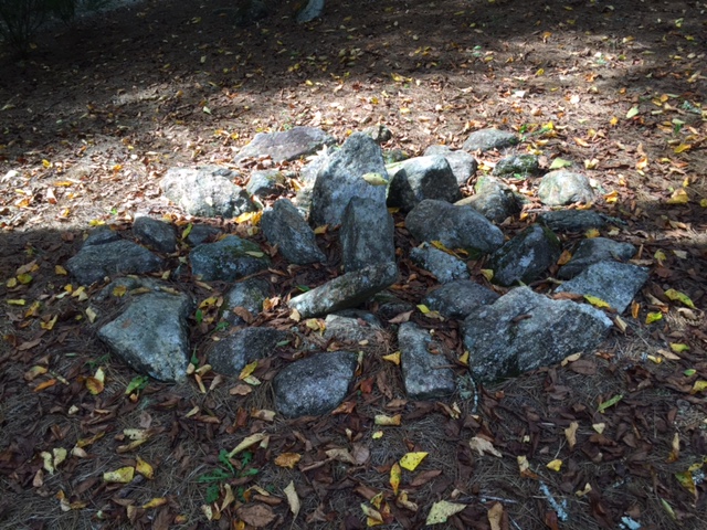 The stone mandala I made about 15 years ago captured in a Yin/Yang moment of shade and sun. 